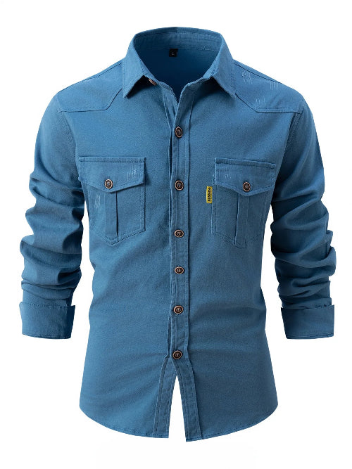 Blue denim shirt with two front pockets on a white background