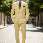 Light yellow suit with a tie and pocket square on a mannequin against a white background