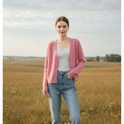 A woman wearing a soft pink fuzzy knit cardigan over a white top, with large text overlay reading 'ASIIMERE' 