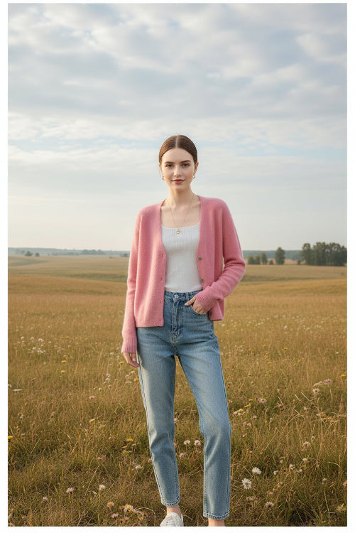 A woman wearing a soft pink fuzzy knit cardigan over a white top, with large text overlay reading 'ASIIMERE' 