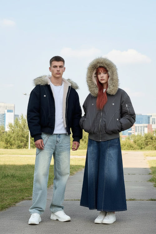 Two people wearing winter jackets and hats in a tiled hallway.