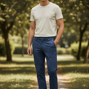 Folded blue pants with a brand logo on a gray background