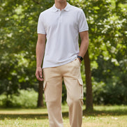 Person wearing beige cargo pants on a white background