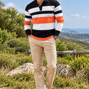 Long-sleeve polo shirt with black, white, and orange stripes on a brown background
