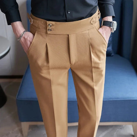 Person wearing tan pants with a blue chair in the background