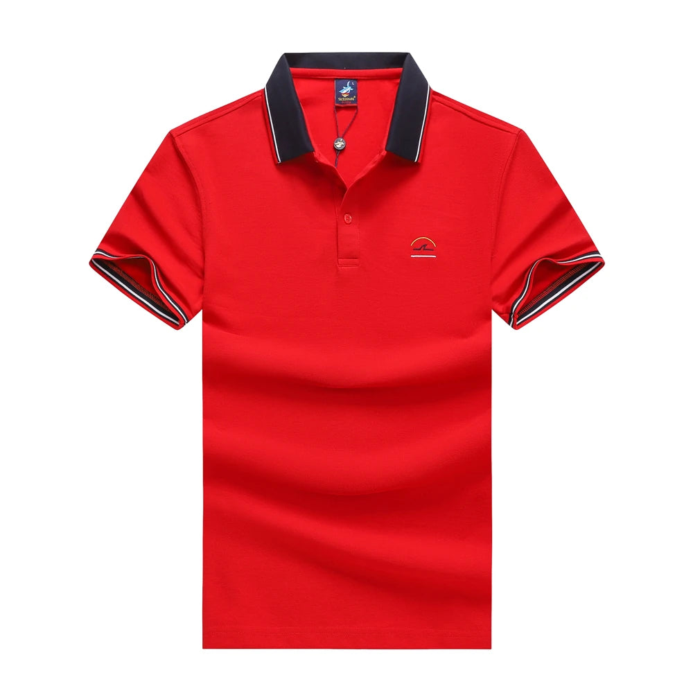 A red short-sleeve polo shirt with a dark navy collar and sleeve trim, featuring a small embroidered logo on the left chest, displayed against a solid white background.