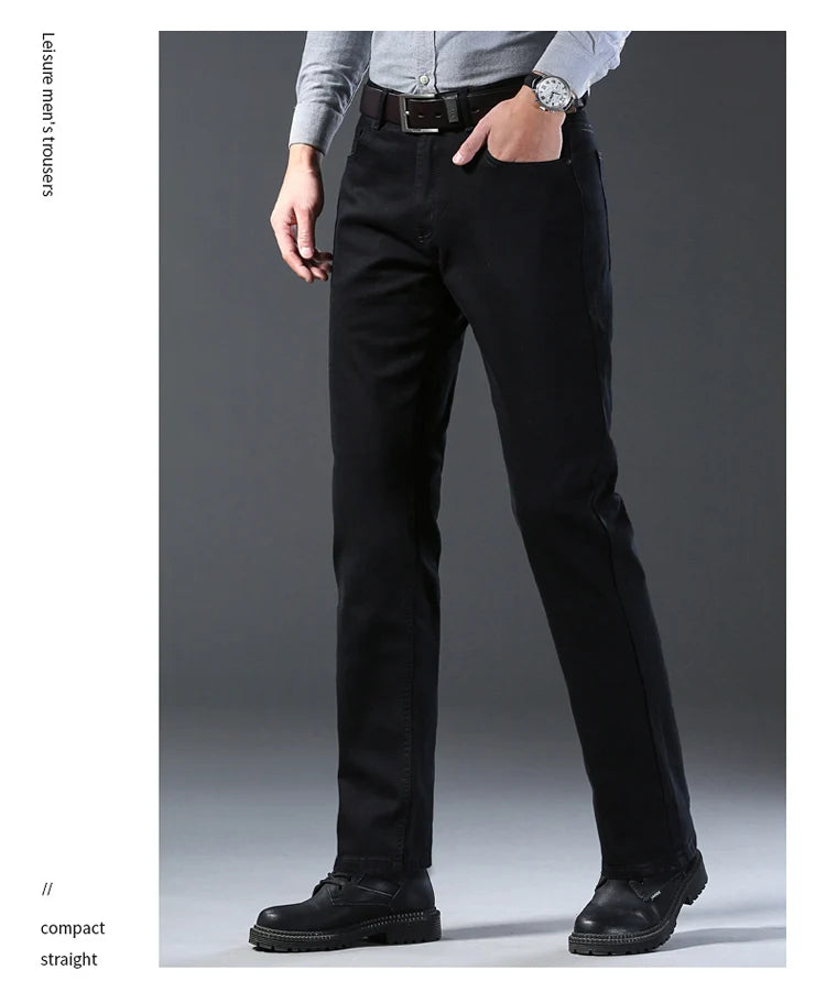 Black pants worn by a person on a gray background