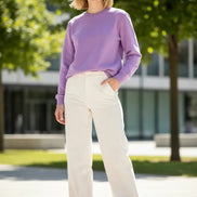 A lavender purple crewneck sweatshirt with long sleeves and ribbed cuffs and hem, 