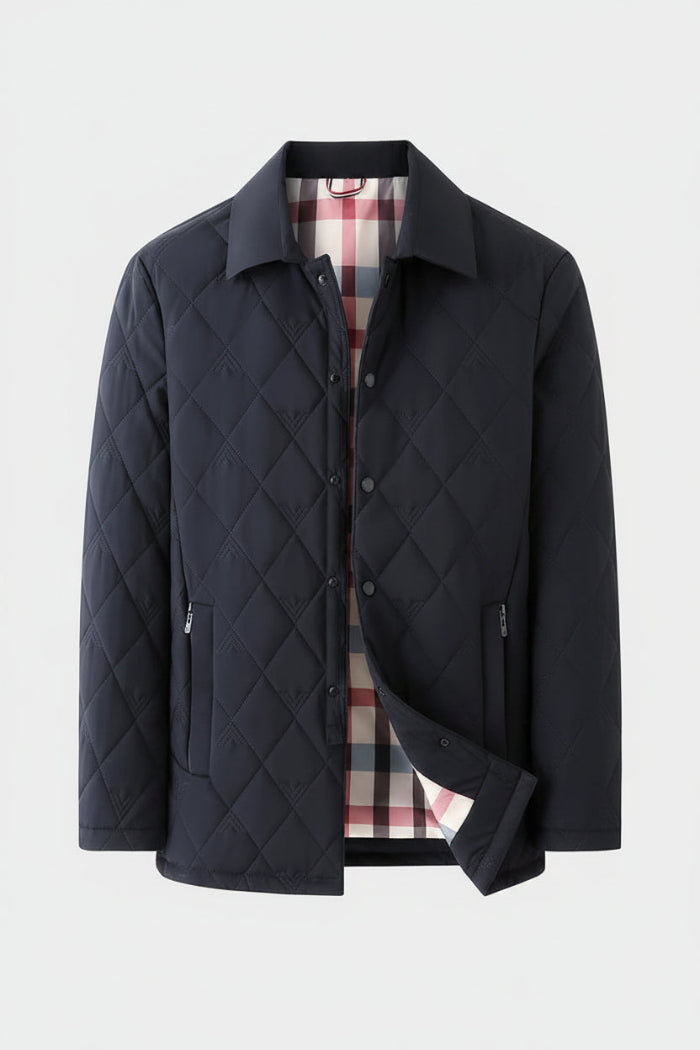 A men's quilted jacket in a very dark navy blue, featuring a diamond-stitched pattern, a pointed collar, and a plaid lining in red, white, and blue. A small black label in the top-left corner reads '望色' (meaning dark navy).