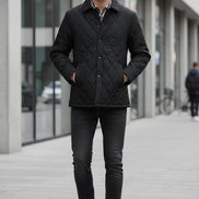 A men's black quilted jacket with a plaid lining, shown on a white background with a brand logo 'LANGBEEYAR' at the top left and two feature callout graphics on the left highlighting thickened fabric and circulate warm technology.