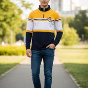 Long-sleeve shirt with yellow, white, and navy design on a white background
