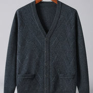 A dark charcoal gray knit cardigan sweater with a V-neck, button-front closure, and two front patch pockets, hanging on a wooden hanger 