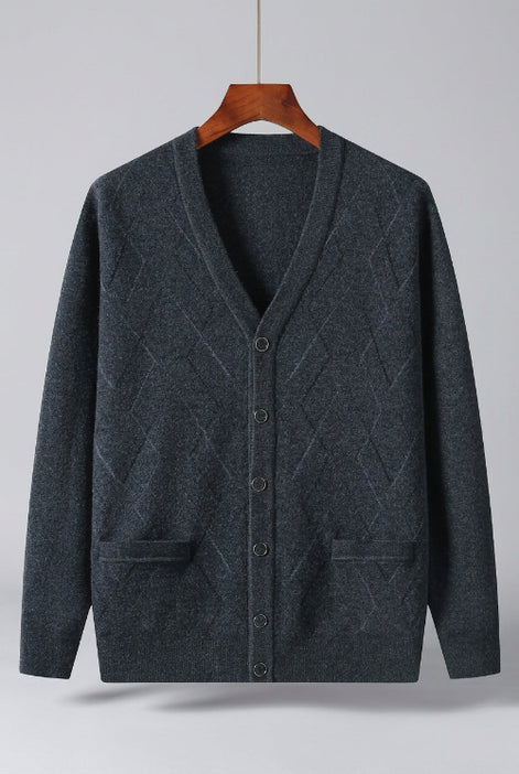 A dark charcoal gray knit cardigan sweater with a V-neck, button-front closure, and two front patch pockets, hanging on a wooden hanger 