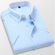 Light blue dress shirt with white collar on a light gray background