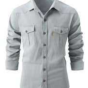 Light gray button-up shirt with two front pockets on a white background