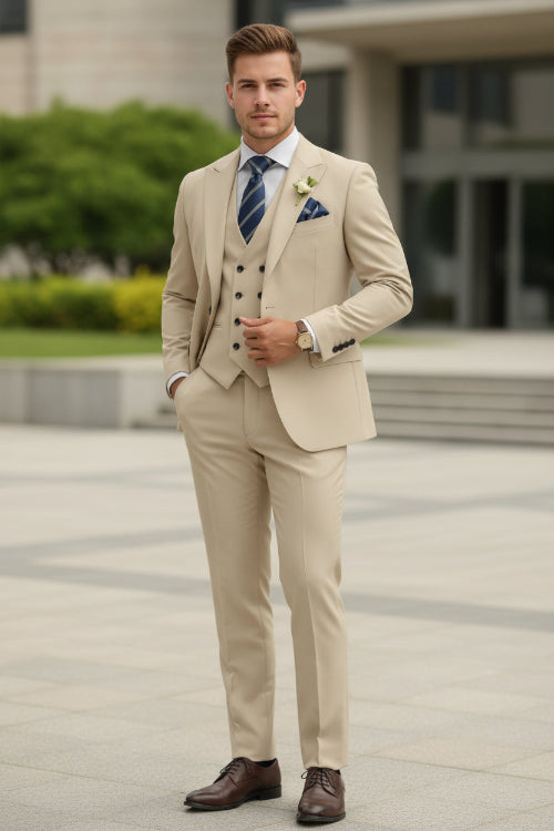 Beige suit with a blue tie and pocket square on a white background
