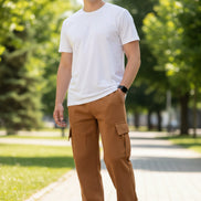 Person wearing brown cargo pants on a white background