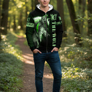 Black hoodie with green wolf design and 'The Wolf' text on a white background