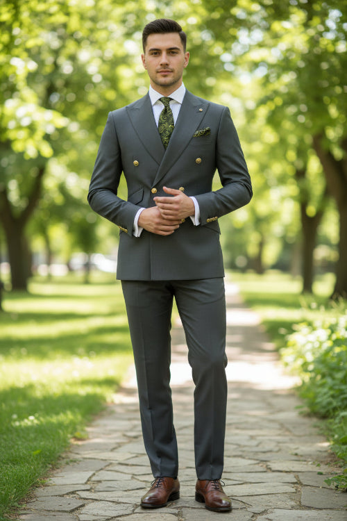 Gray suit jacket with gold buttons and matching pants on a white background