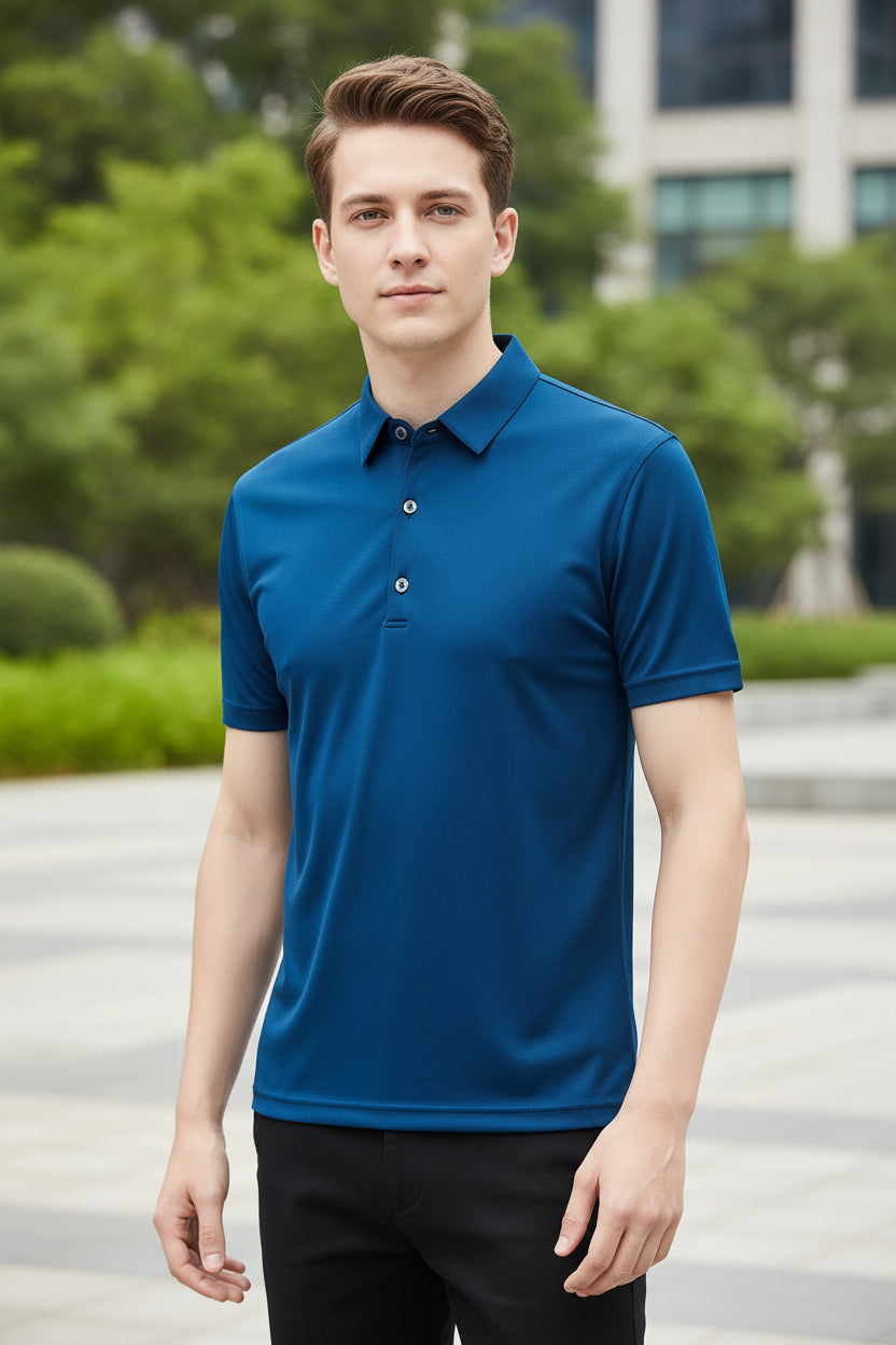 Blue polo shirt worn by a person on a gray background