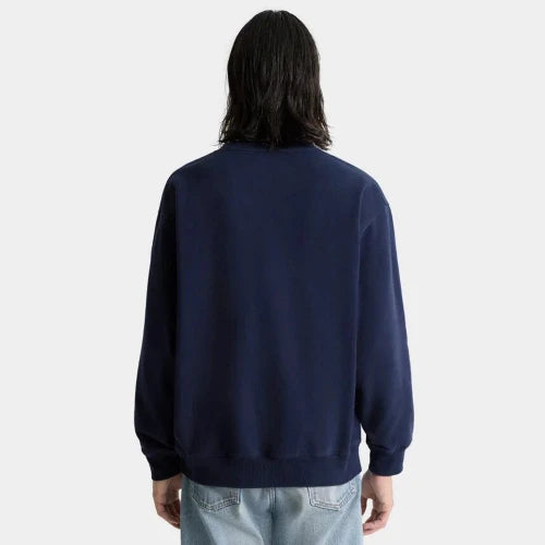 Person wearing a navy blue sweatshirt on a white background
