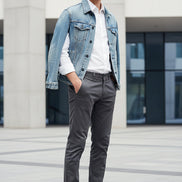 Pair of black leather shoes on a light gray background
