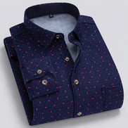 Folded navy blue shirt with red pattern on a white background