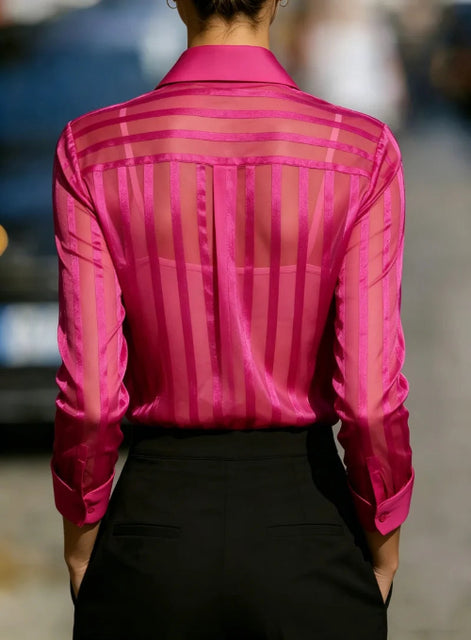 Pink sheer striped shirt worn by a model, shown from the back.
