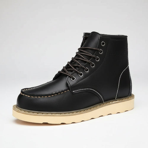 Black leather boot with beige sole on a white background