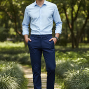 Person wearing blue pants with a gray background