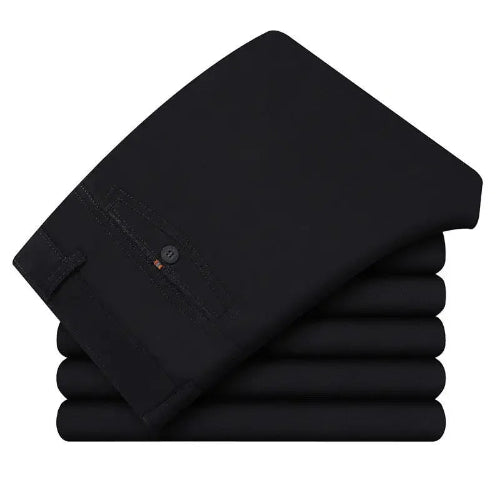 Stack of black pants on a white background