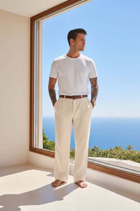 Person wearing beige pants with a blurred scenic background