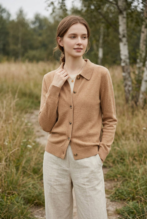 Woman wearing a brown button-up shirt with a blurred background