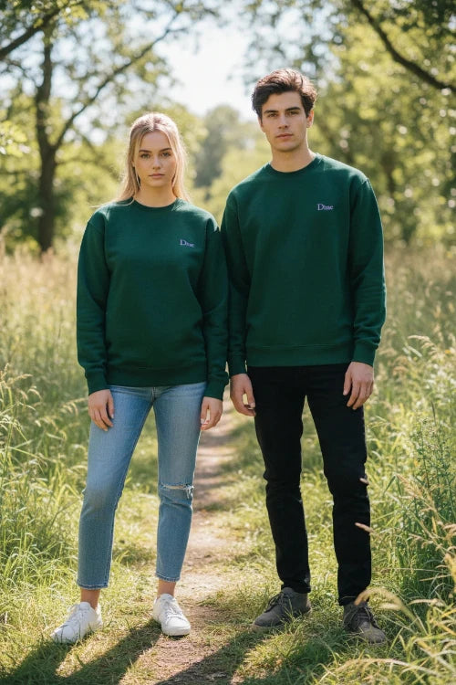 A dark green crewneck sweatshirt with a small purple embroidered 'Dime' logo on the left chest, displayed flat against a solid white background.