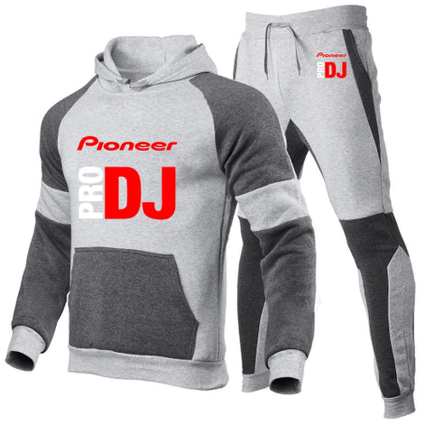 A two-piece athletic tracksuit set featuring a raglan hoodie and matching joggers in heather gray and dark gray, 