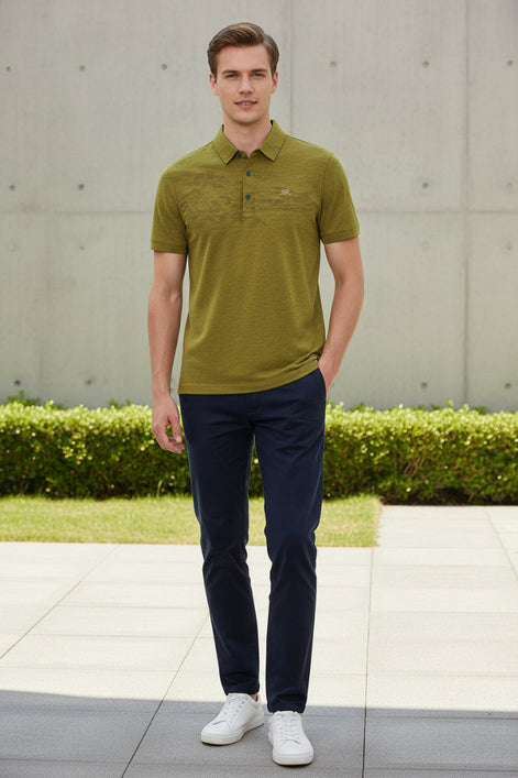 A close-up of a textured olive green short-sleeve polo shirt on a black hanger, with a hand pointing to the left chest area where a small white 'NEWSPORT' logo is embroidered.