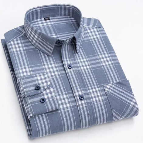A folded long-sleeve plaid button-up shirt in slate blue and white, featuring a classic collar, button front, and a chest pocket.