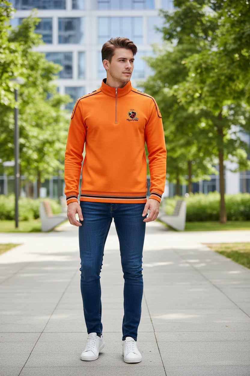 Orange long-sleeve shirt with black accents and a logo on a white background, featuring the Tace & Shark brand.
