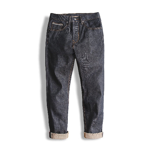 Pair of dark blue jeans on a white background