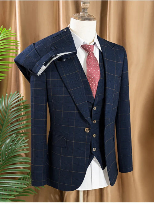 Navy checkered suit on a mannequin against a beige curtain background