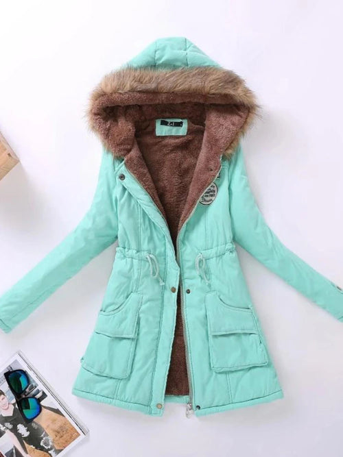 Mint green winter coat with brown fur lining on a white background