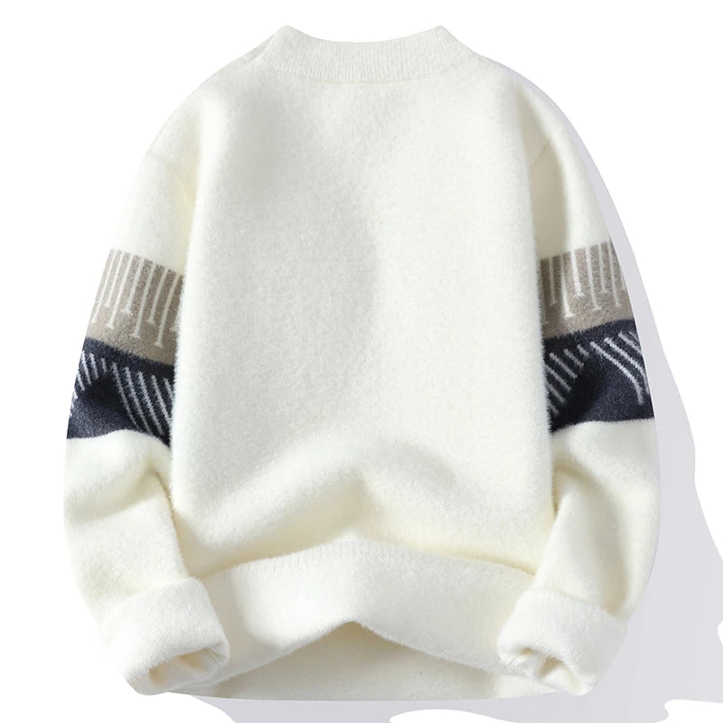 White sweater with patterned sleeves on a white background