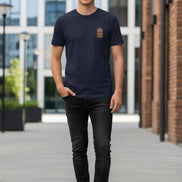 Navy blue t-shirt with a brown patch on a hanger against a white background