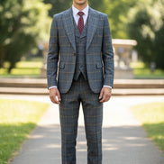 Blue checkered suit on a mannequin with a brown curtain background