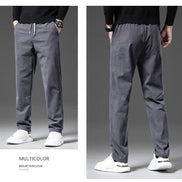 A split-view catalog image showing a man modeling gray drawstring sweatpants from the front and back, paired with a black top and white sneakers. 