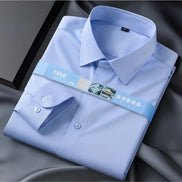 Folded light blue dress shirt with a brand label on a dark background