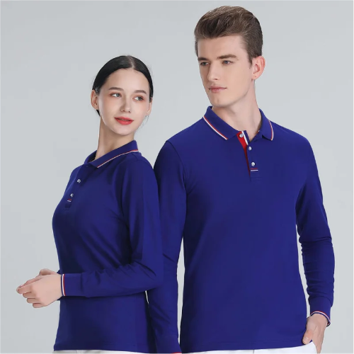 A man and a woman modeling matching royal blue long-sleeve polo shirts with white and red striped collar trim, posed against a light gray studio background.
