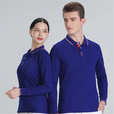 A man and a woman modeling matching royal blue long-sleeve polo shirts with white and red striped collar trim, posed against a light gray studio background.