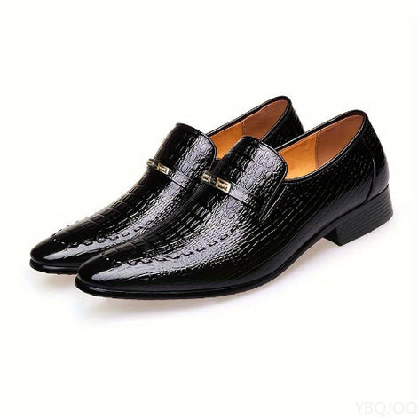 Pair of black dress shoes on a white background