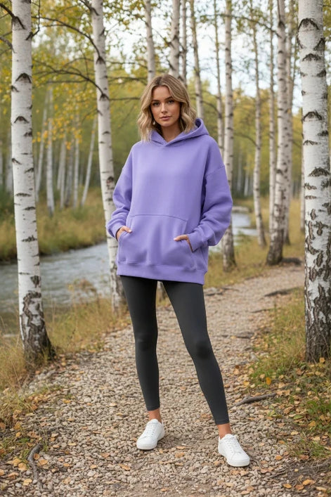 Purple hoodie worn by a person on a white background